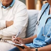 A color photo showing a medical professional talking with a patient. Credit: Shutterstock